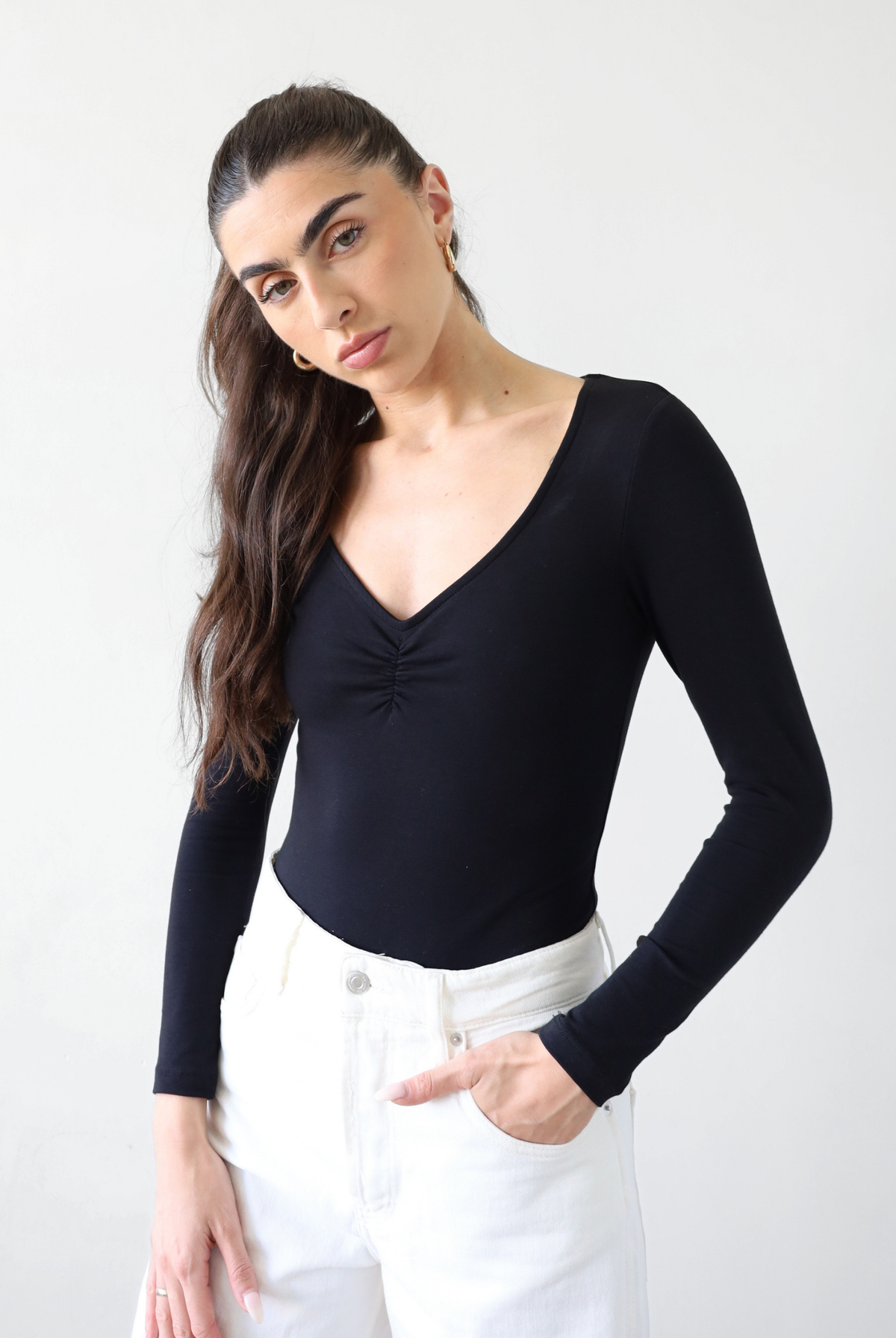 Organic cotton black v-neck long sleeve bodysuit, front