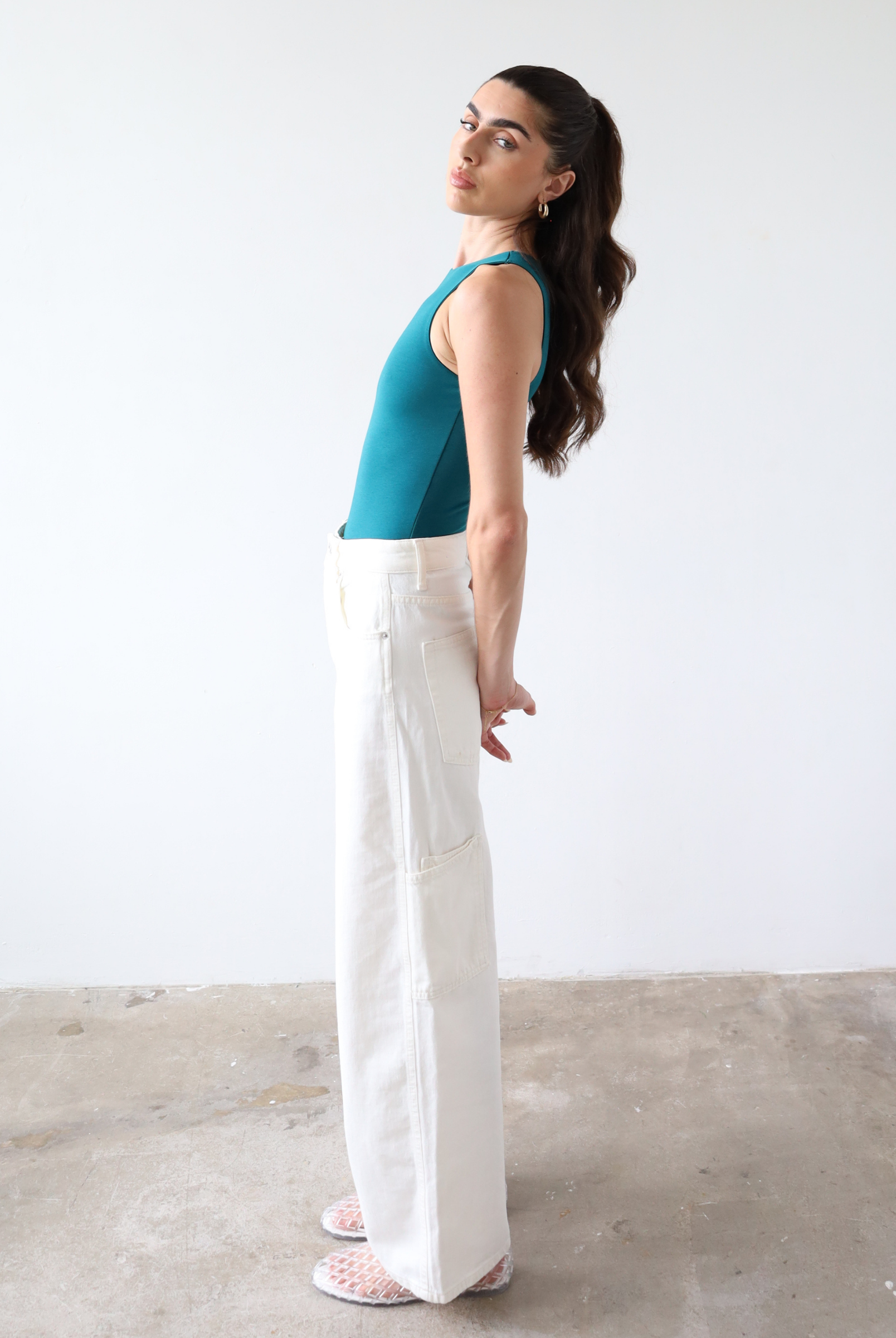 Organic cotton teal sleeveless bodysuit, side