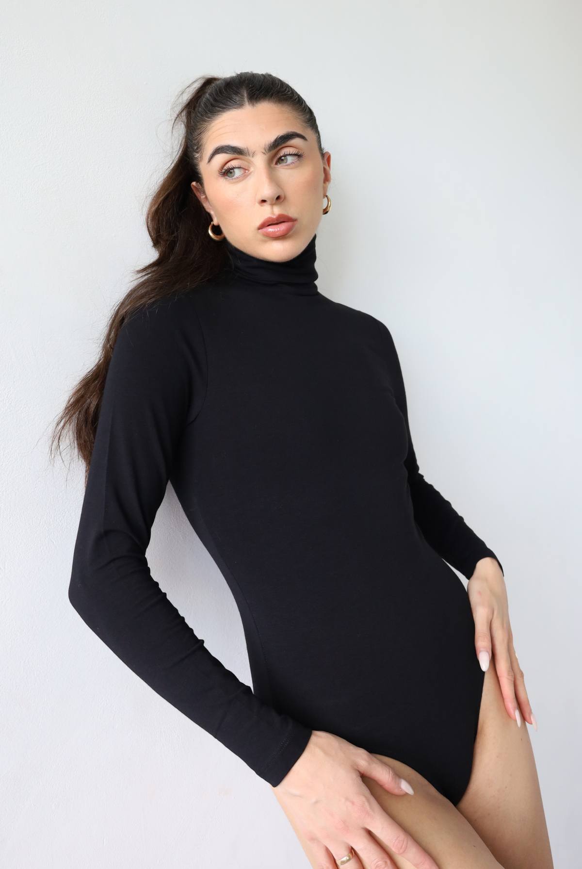 Organic cotton black roll neck long sleeve bodysuit, front