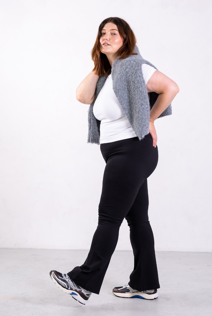 side of black organic cotton flared leggings