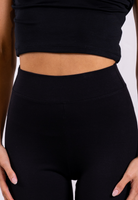 close up of black organic cotton flared leggings