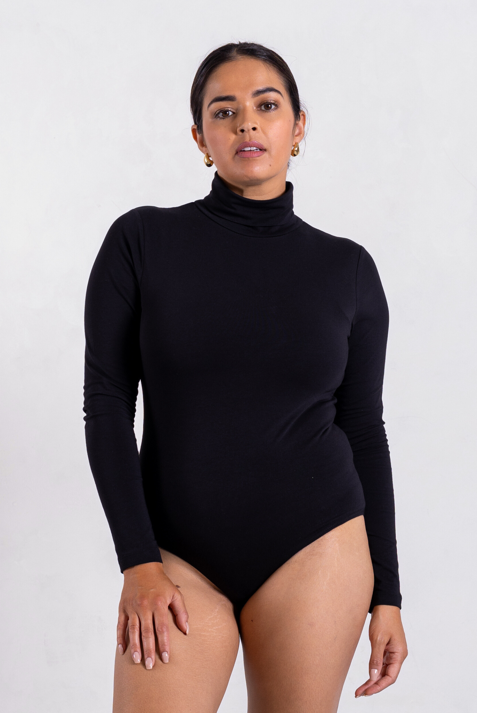 front of black organic cotton roll neck long sleeve bodysuit