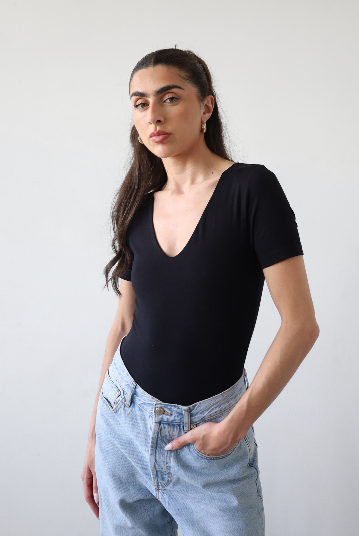 Organic cotton black v-neck short sleeve bodysuit, front