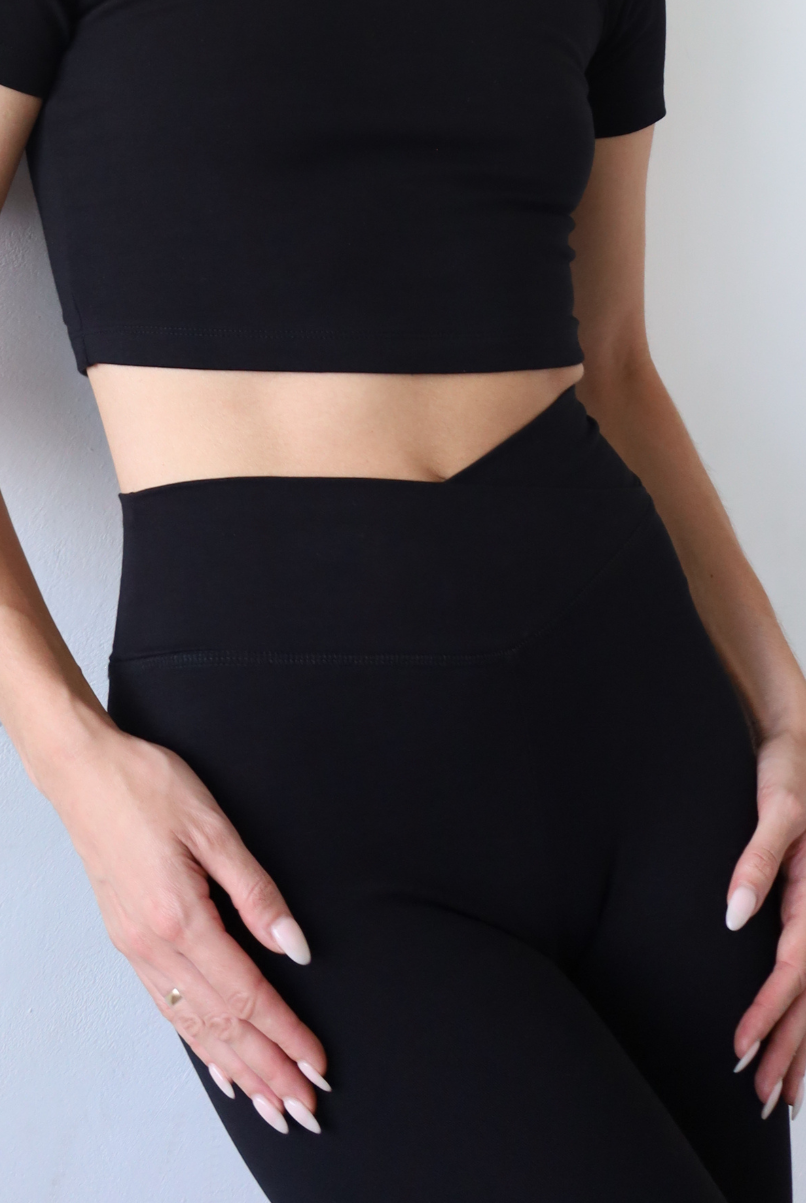 Organic cotton black wrap waist leggings, close up waistband