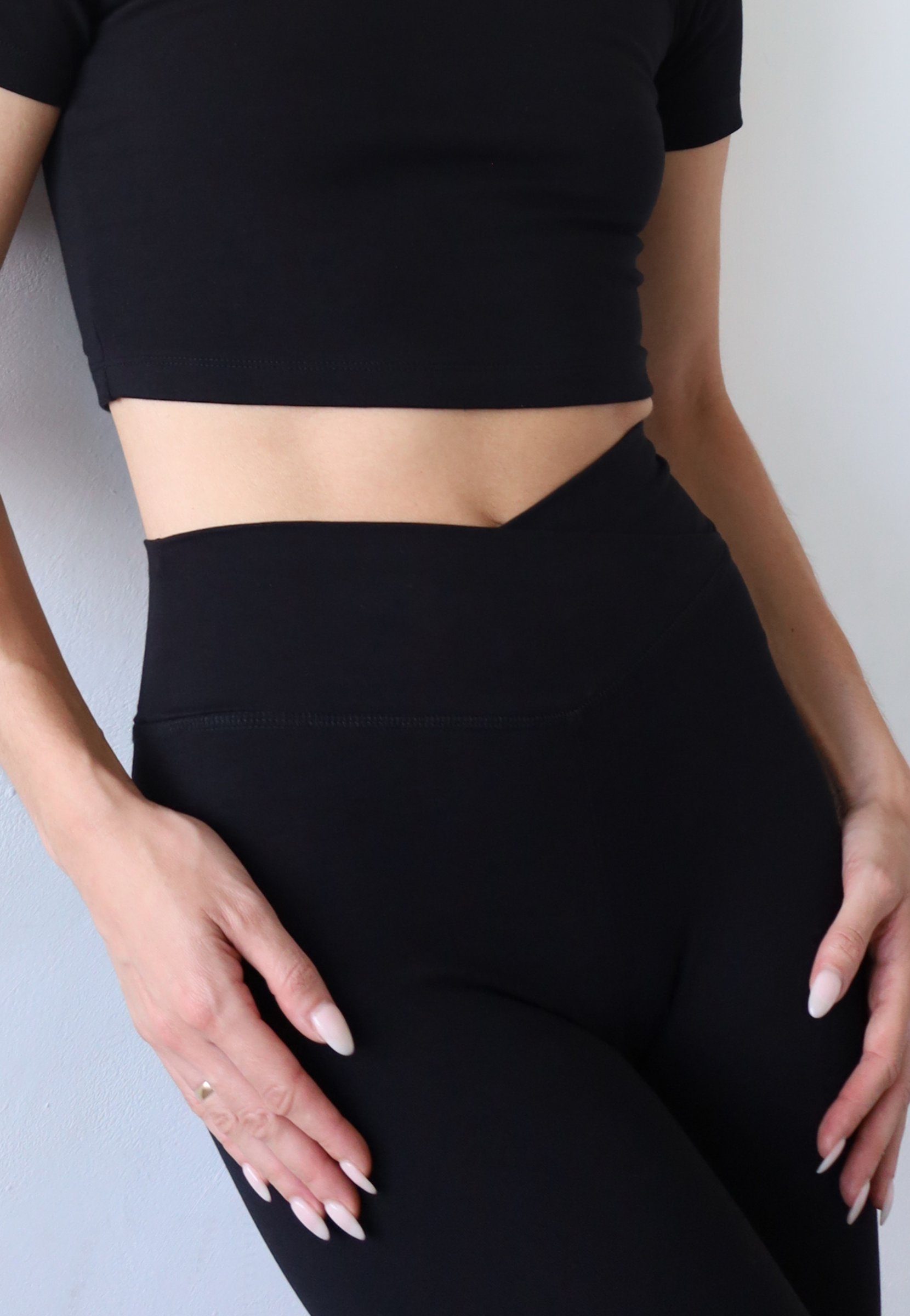 Organic cotton black wrap waist leggings, close up waistband