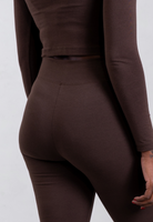 back of brown organic cotton flared leggings