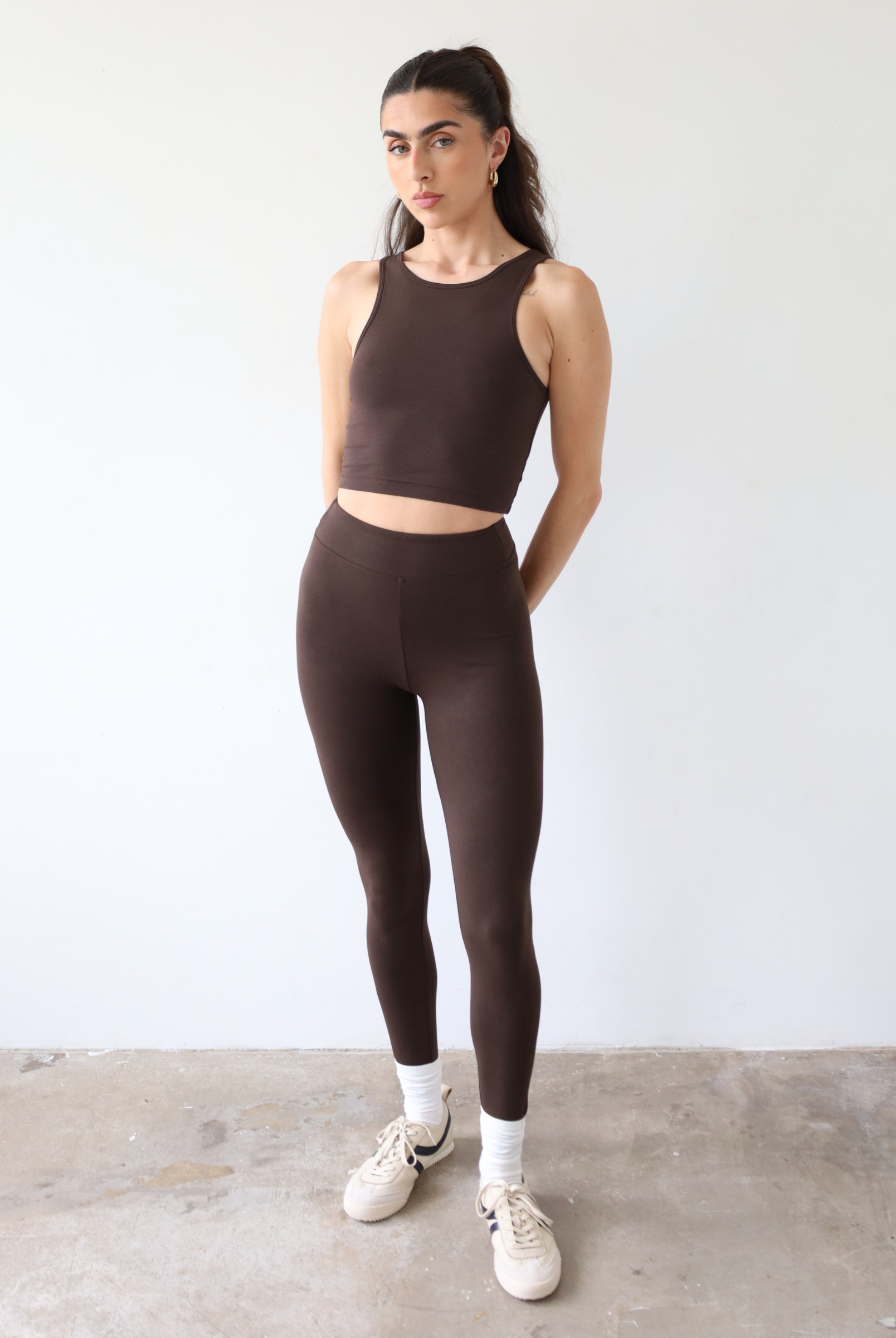 organic cotton dark brown leggings on model, front