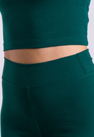 close up of green organic cotton leggings