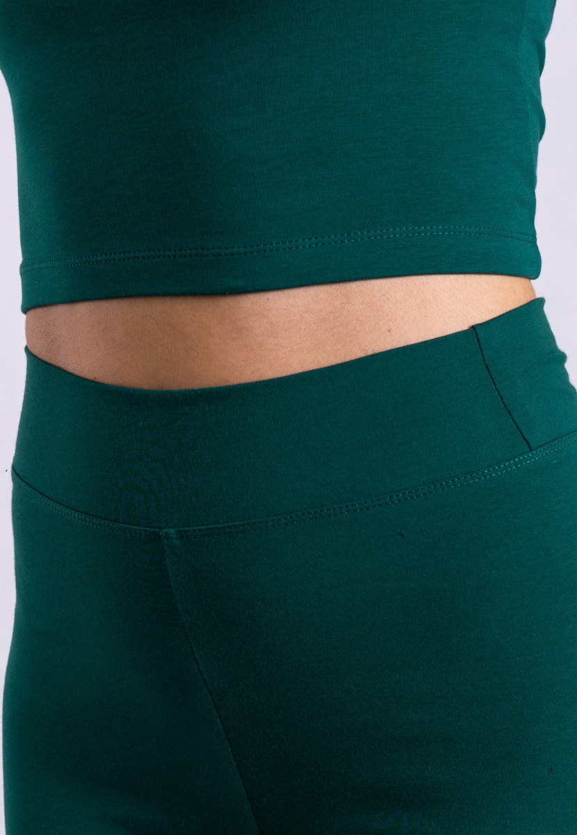 close up of green organic cotton leggings