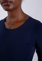 close up of navy blue organic cotton crew neck long sleeve bodysuit