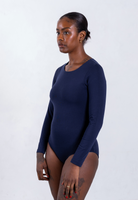 side of navy blue organic cotton crew neck long sleeve bodysuit