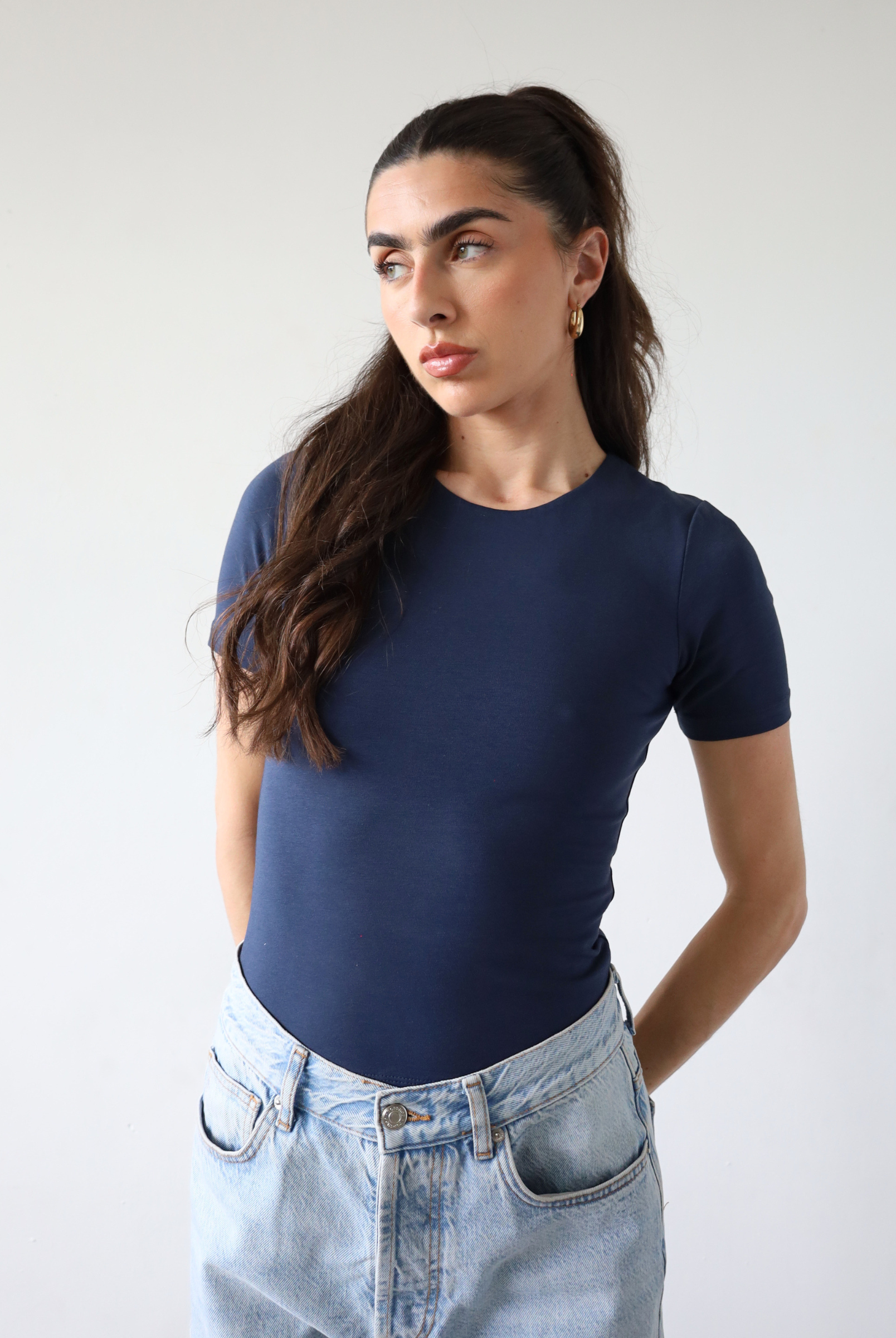 Organic cotton navy blue short sleeve t-shirt on model, front