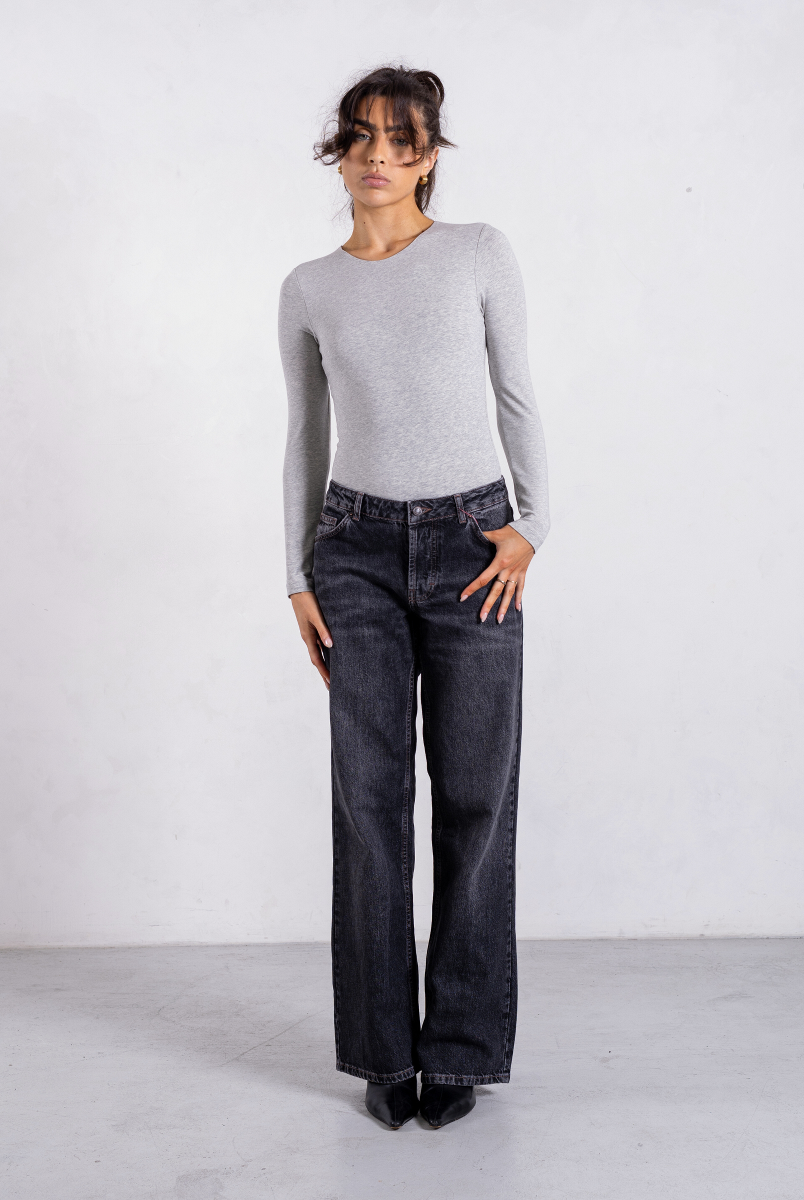 styled image of grey organic cotton crew neck long sleeve bodysuit