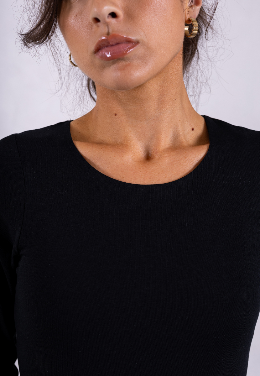 close up of black organic cotton long sleeve bodysuit