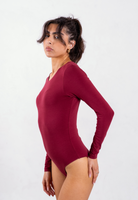 side of red organic cotton long sleeve crew neck bodysuit