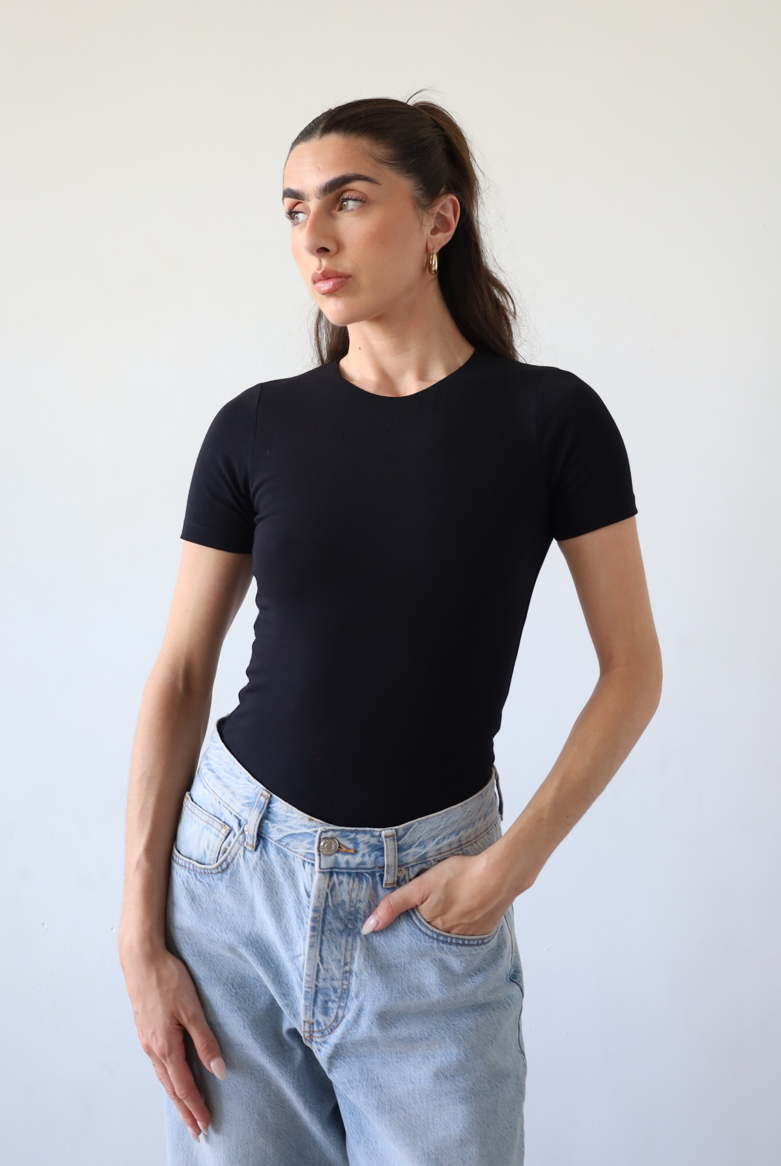 Organic cotton black crew neck short sleeve bodysuit, front