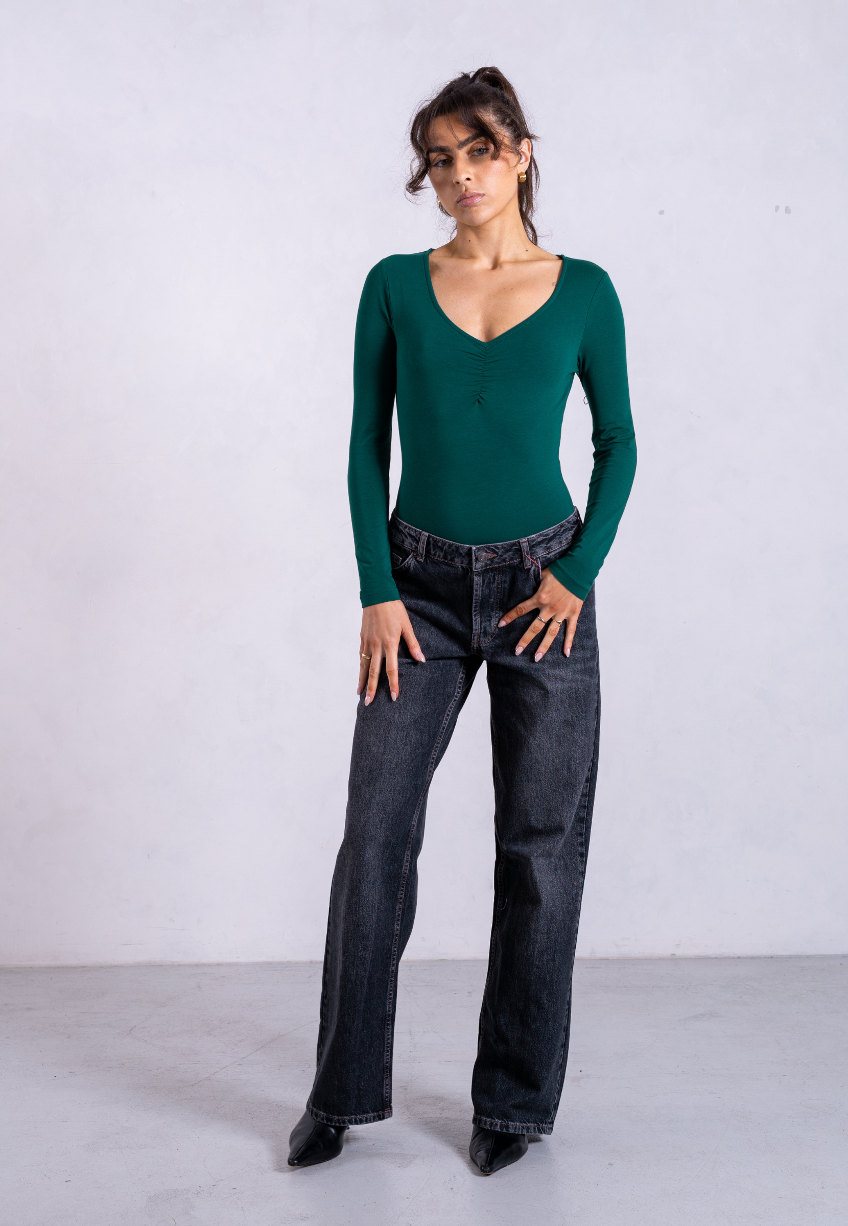 styled image of green organic cotton sweetheart long sleeve bodysuit
