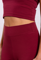 close up of red organic cotton leggings