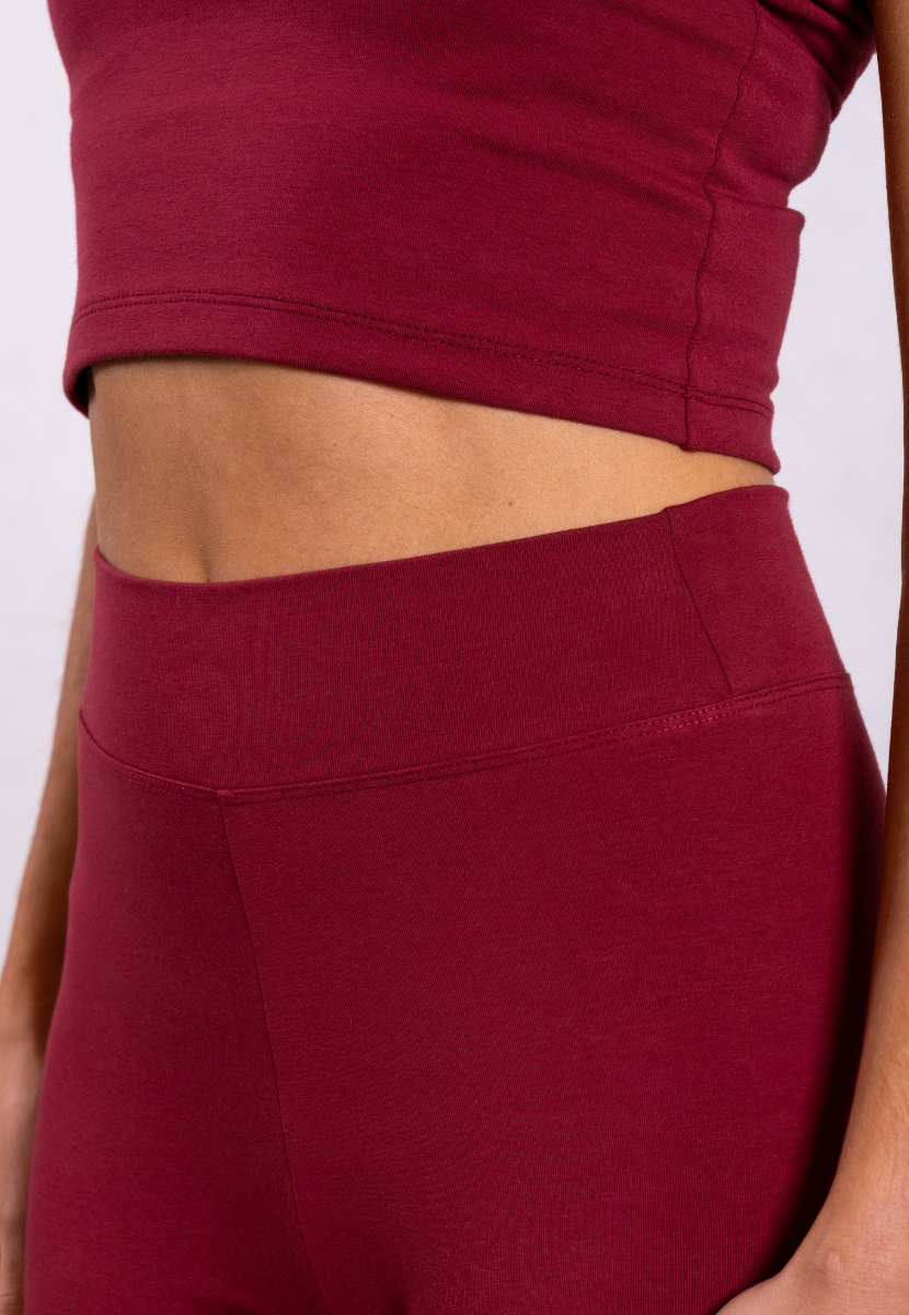 close up of red organic cotton leggings