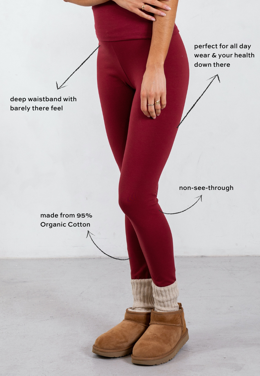 side of red organic cotton leggings