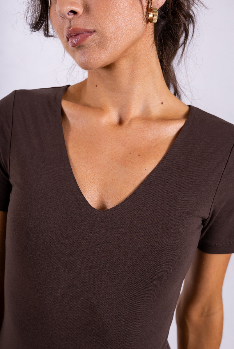 close up of brown organic cotton short sleeve v-neck bodysuit