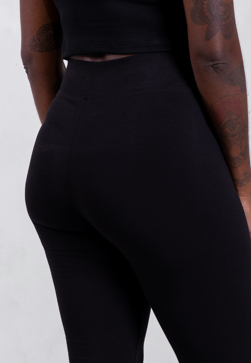 back of black organic cotton flared leggings