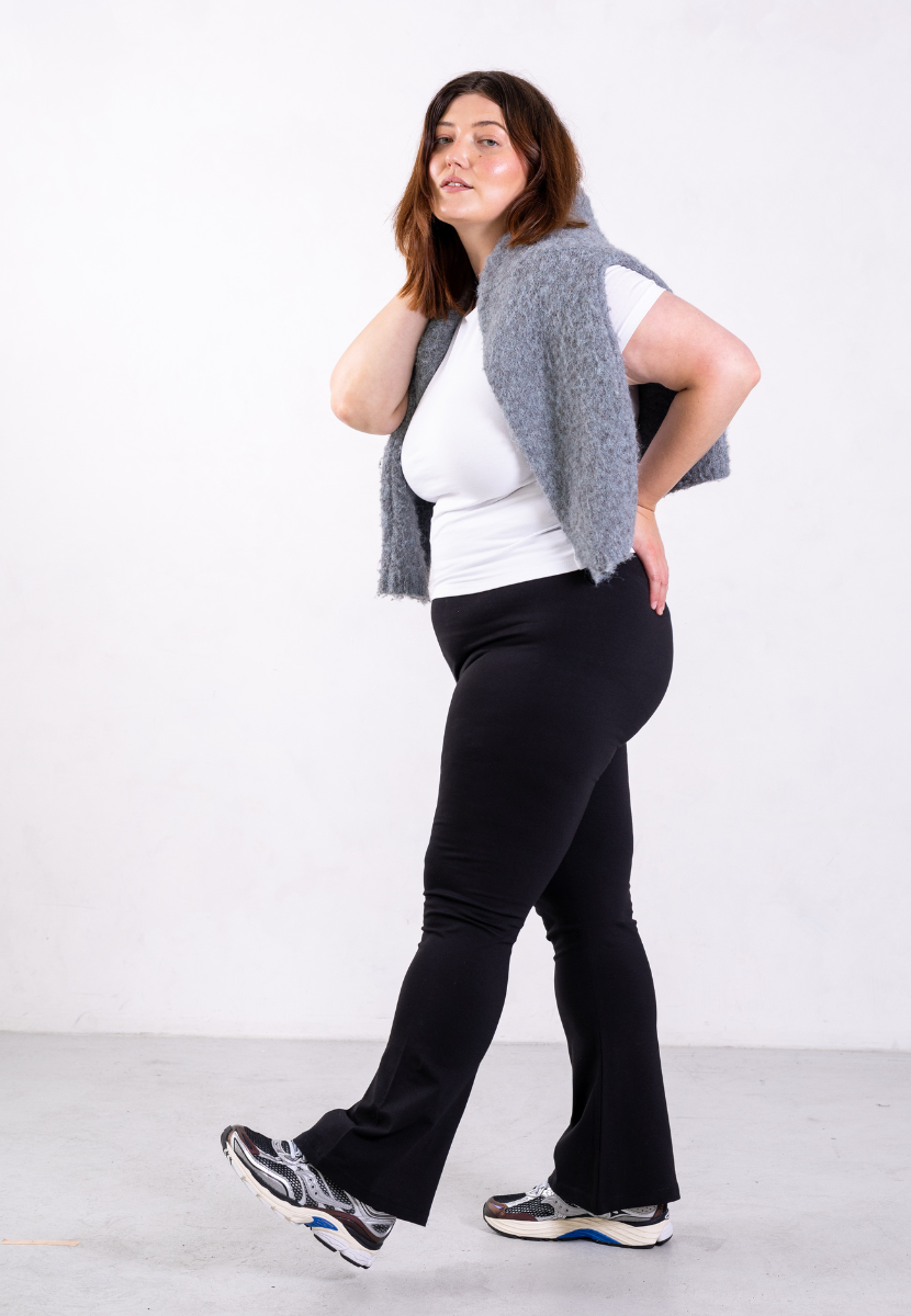 side of black organic cotton flared leggings