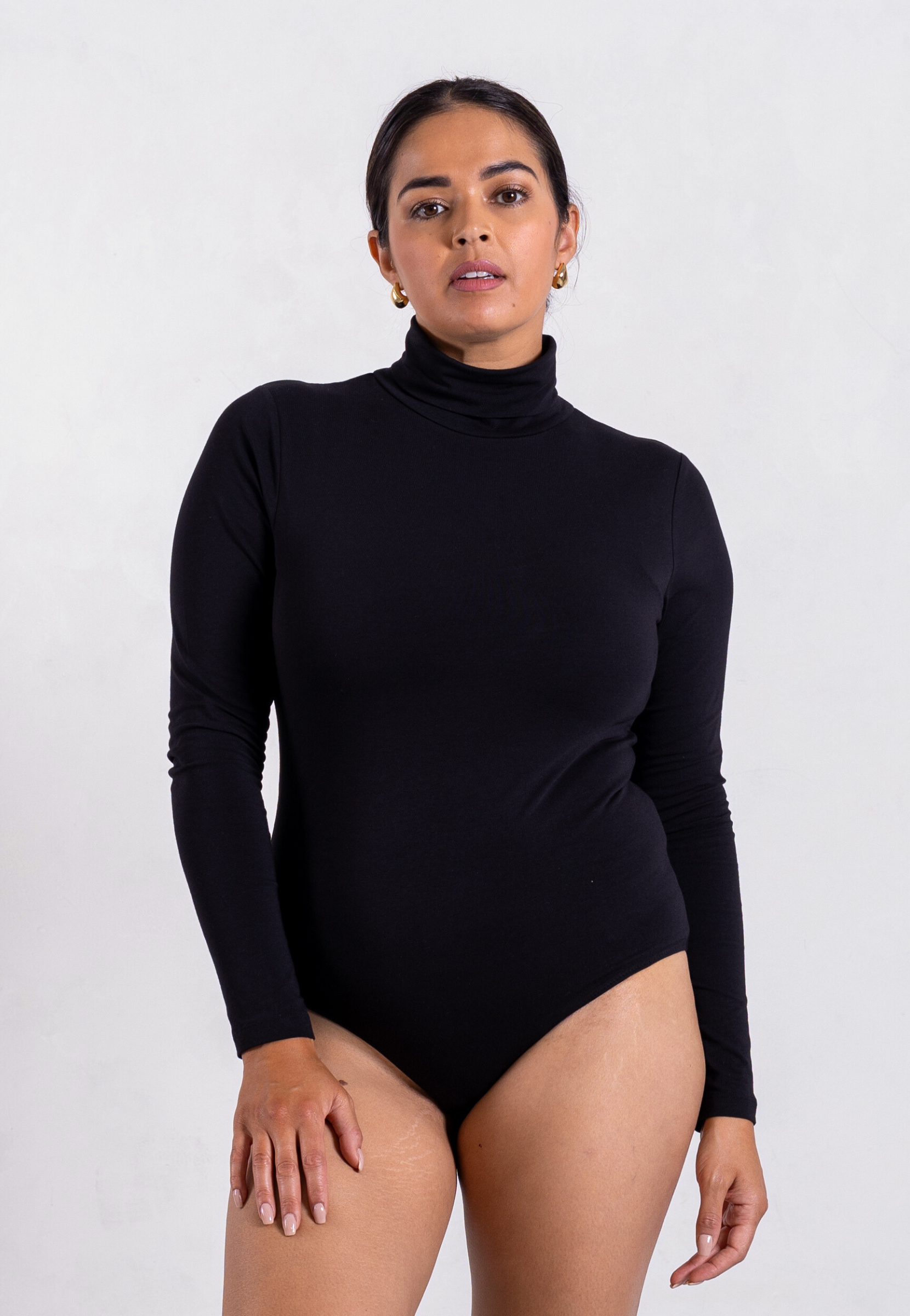front of black organic cotton roll neck long sleeve bodysuit