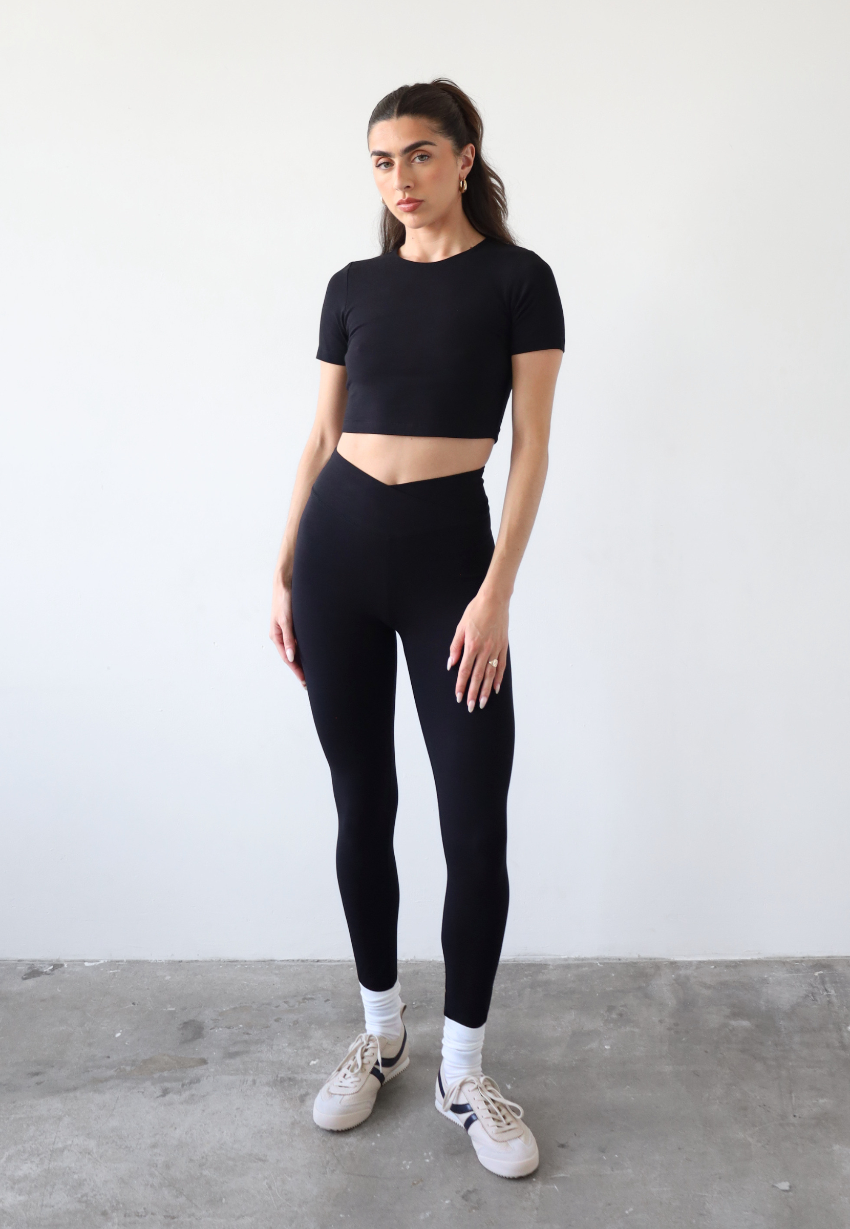 Organic cotton black wrap waist leggings, front 