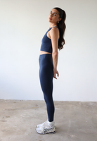 Organic cotton navy blue leggings on model, side