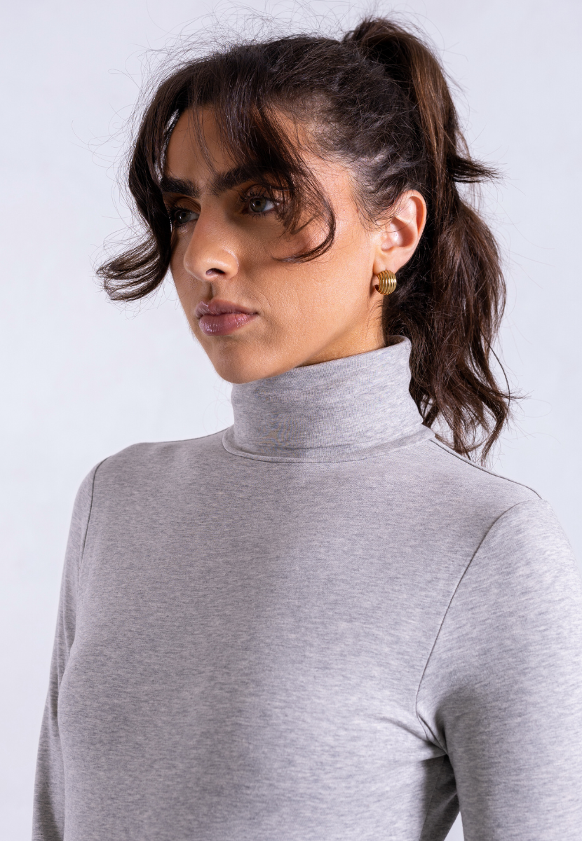 close up of grey organic cotton roll neck long sleeve bodysuit