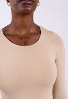 close up of organic cotton long sleeve oat crew neck bodysuit