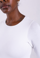 close up of organic cotton long sleeve white crew neck bodysuit