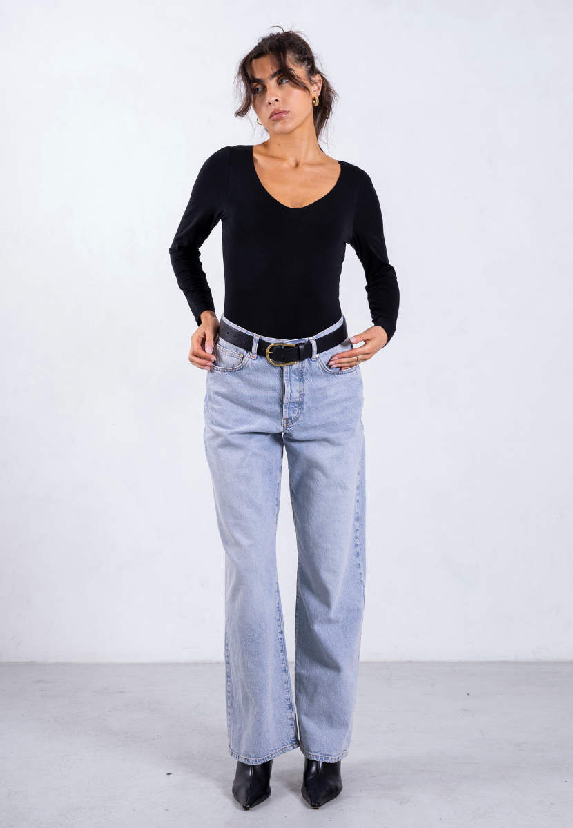 styled image of black organic cotton v-neck long sleeve bodysuit