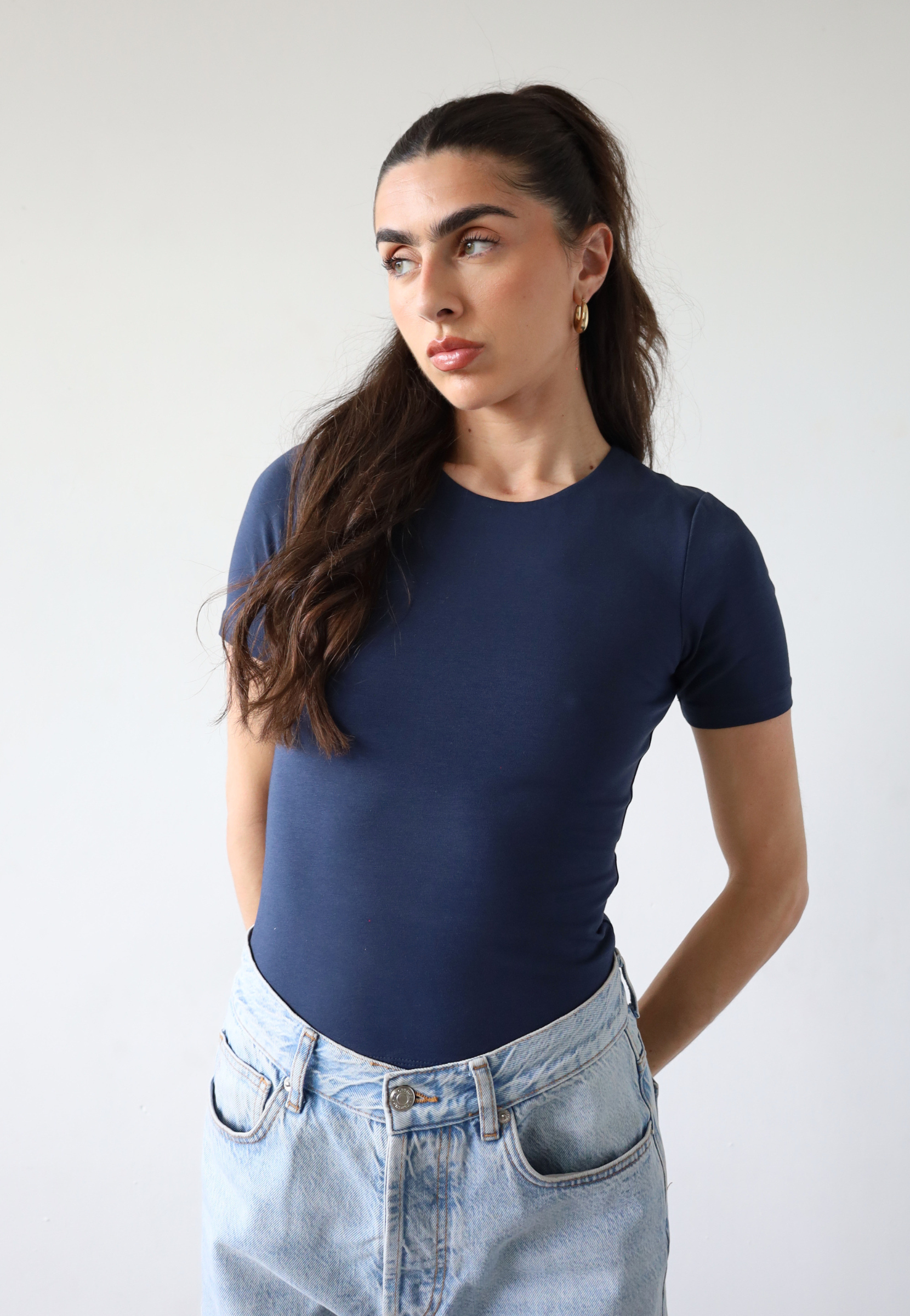Organic cotton navy blue short sleeve t-shirt on model, front