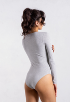 side of grey organic cotton crew neck long sleeve bodysuit