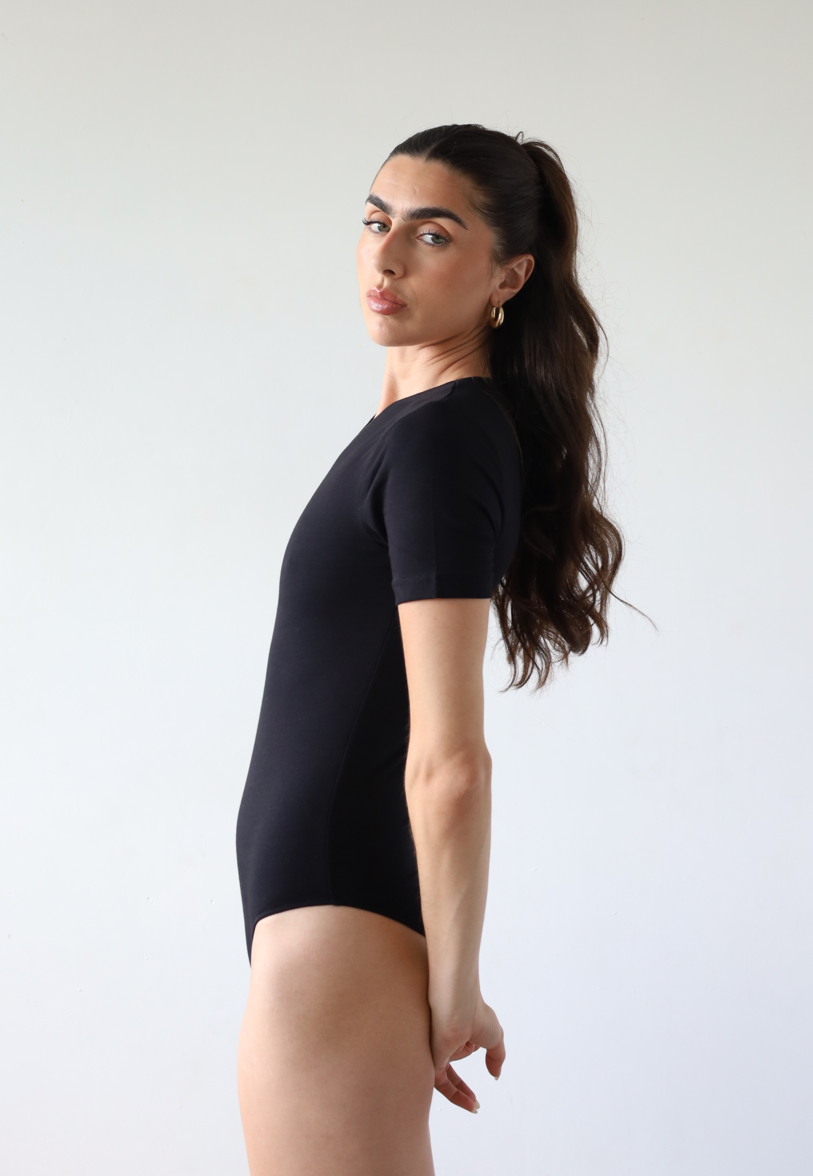 Organic cotton black crew neck short sleeve bodysuit, side