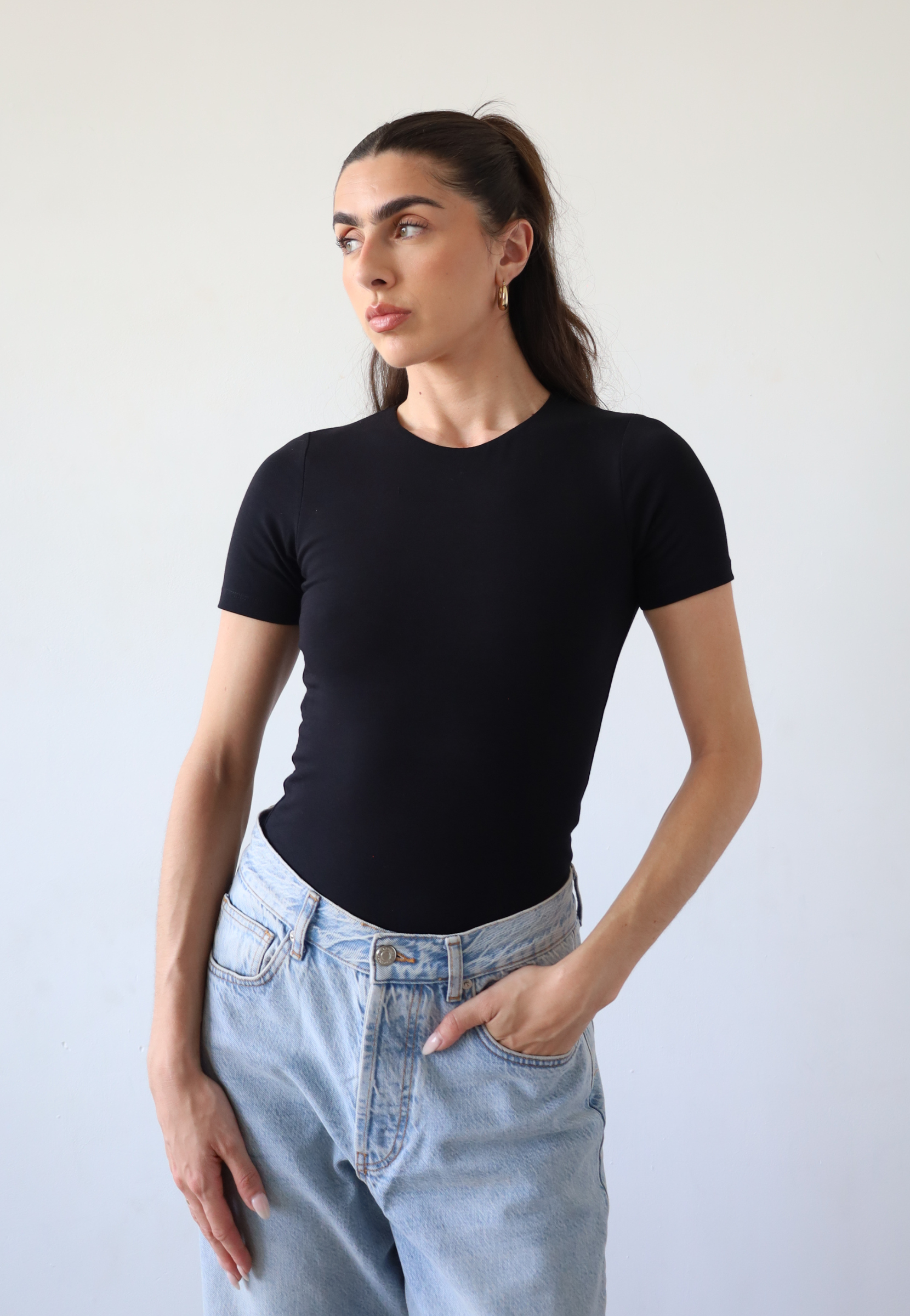 Organic cotton black crew neck short sleeve bodysuit, front
