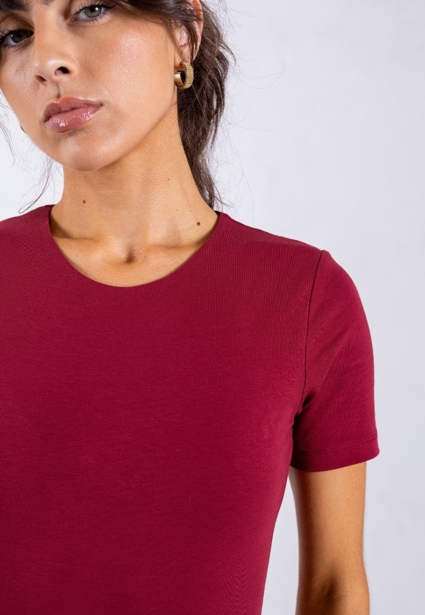 close up of red organic cotton short sleeve crew neck bodysuit