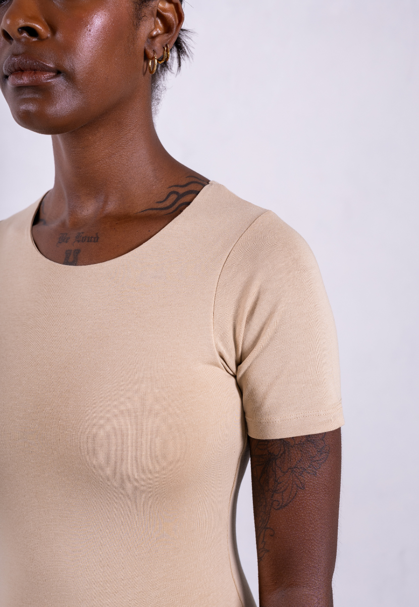 close up of organic cotton crew neck oat short sleeve bodysuit