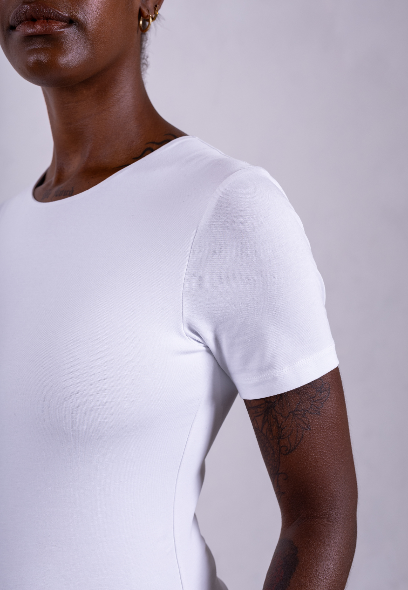 close up of organic cotton crew neck white short sleeve bodysuit