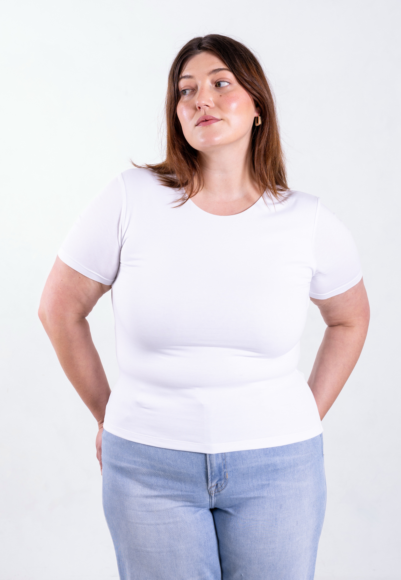 model wearing women's white organic cotton t-shirt in size 2XL, showing fit and style on fuller figure